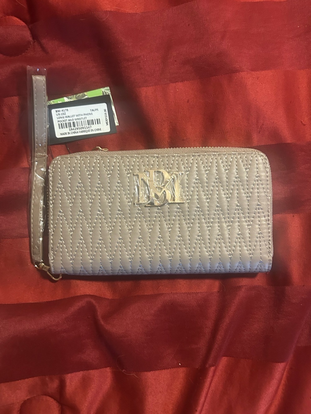 Badgley Mischka Quilted Zip Wristlet in Taupe with silver logo